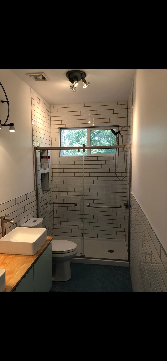 Bathroom remodel — new tile, vanity, shower, and fixtures