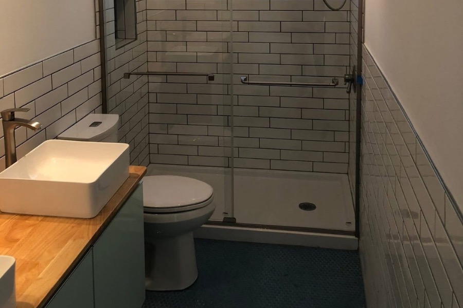 Bathroom with shower, toilet, and sink